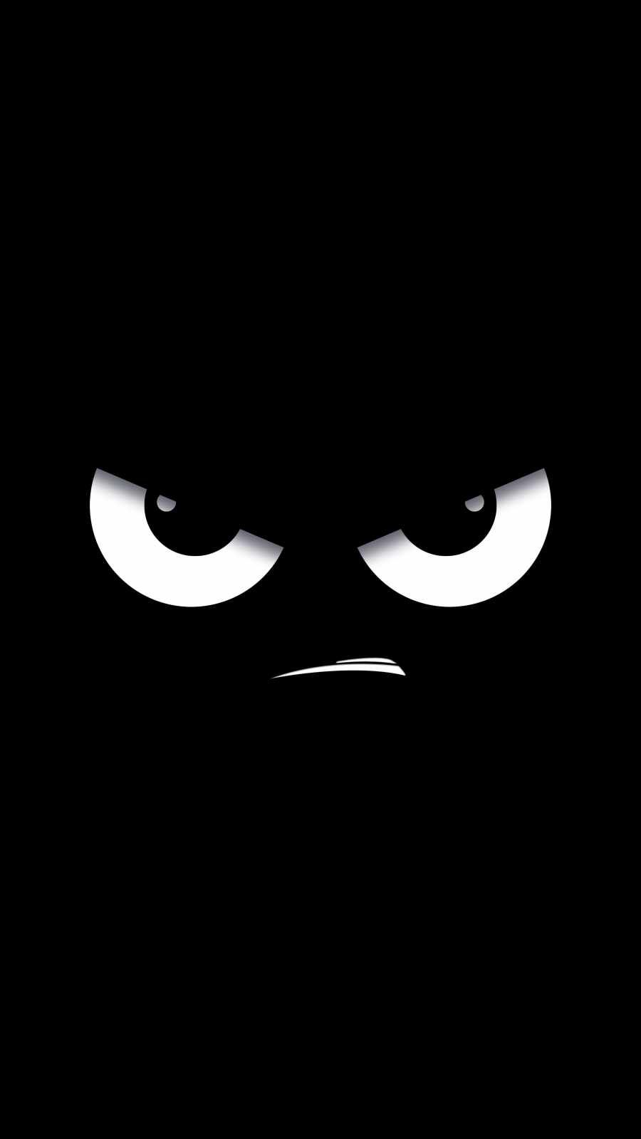 An angry reaction face emerging from black